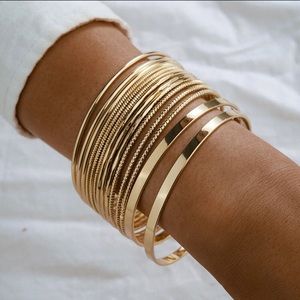 Set of 14 gold bangle bracelets.